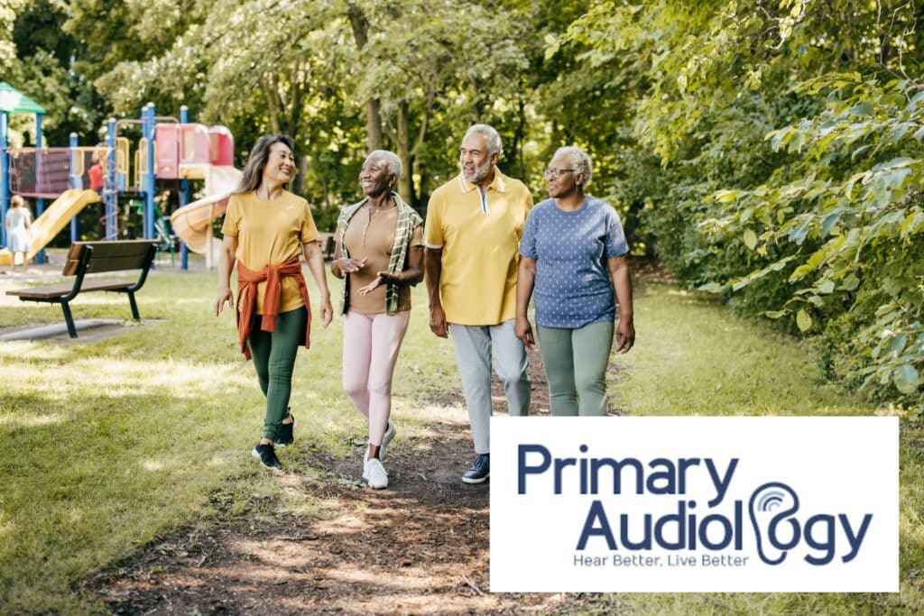 older people walking in a park